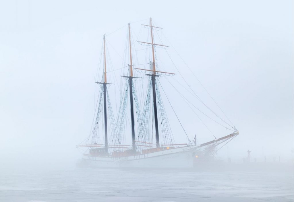 Ship in fog symbolizing COVID health decline