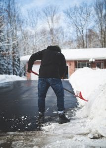 Man shoveling driveway as metaphor for Functional nutitionist anxiety support