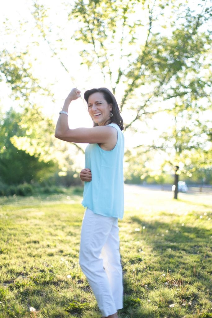 Kristy Hall, MS, RNCP, ROHP Board Certified Functional Nutritionist showing her strength
