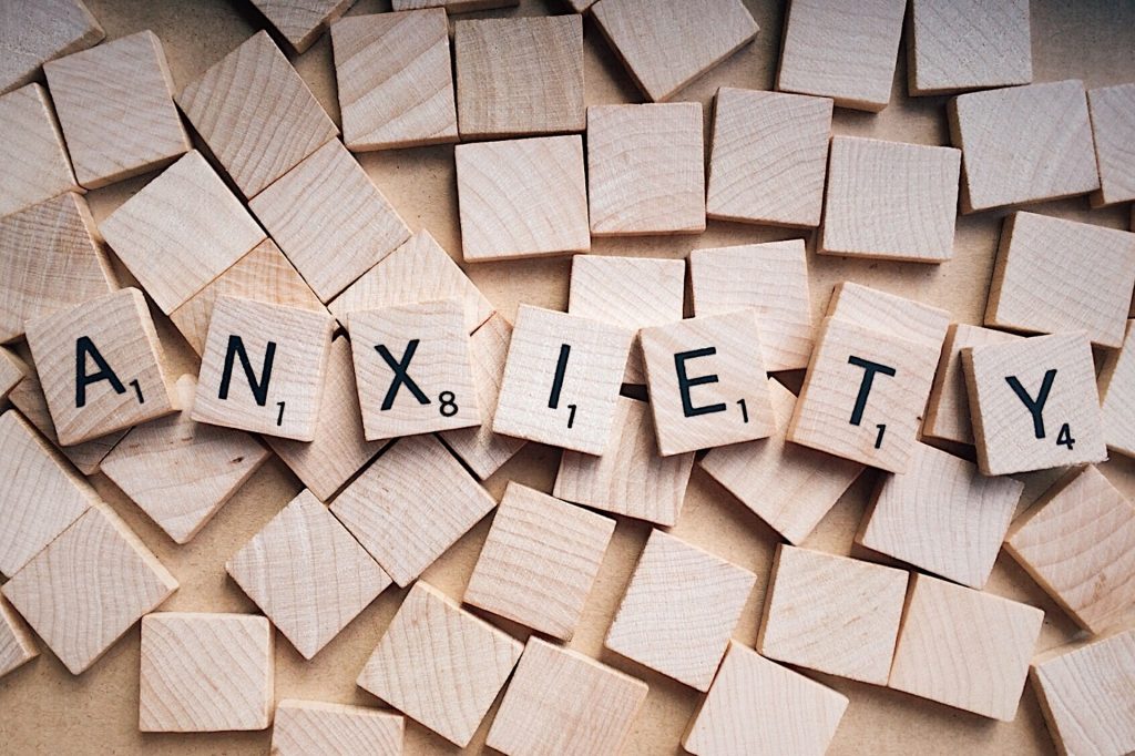 anxiety spelled with scrabble tiles