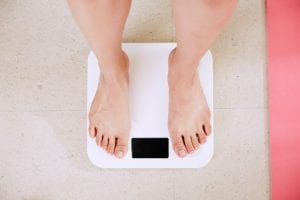 weighing part of achieving healthy weight loss goals