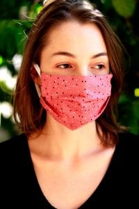 woman wears mask to prevent spread of COVID-19
