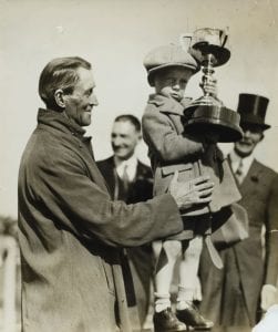 kid holding trophy